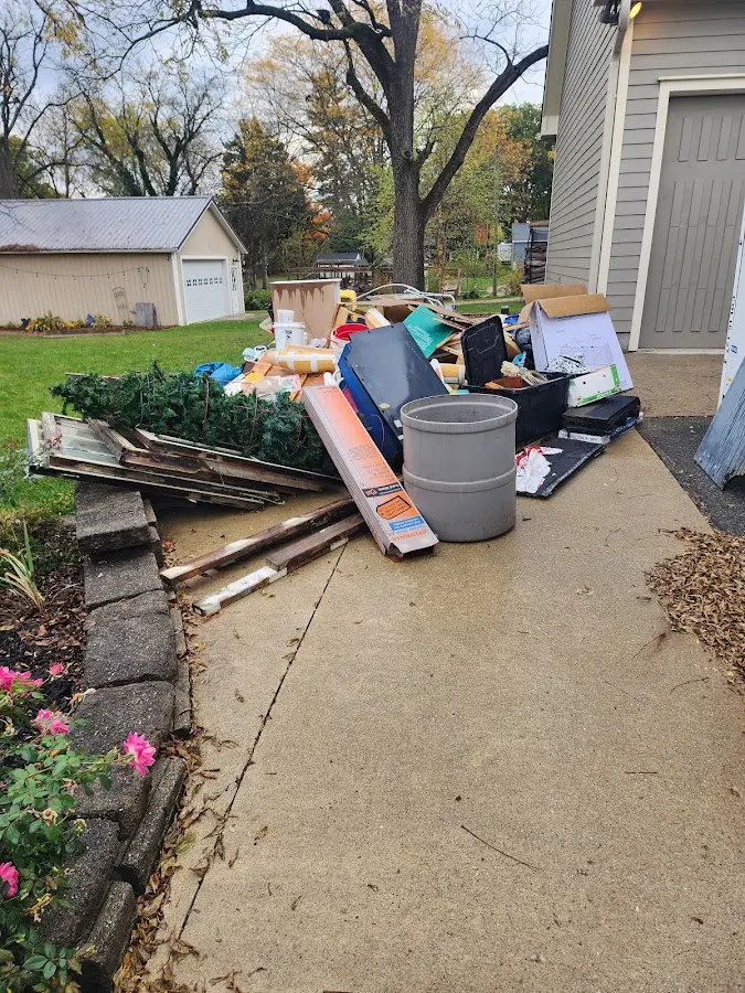Dumpster being loaded with debris for 3 Yard Dumpster Rental in Viera East